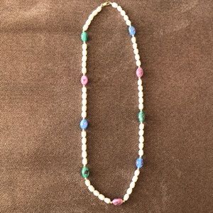 Fresh water oval pearl beads with glass and gold tone beads, 21 1/2 “ long.